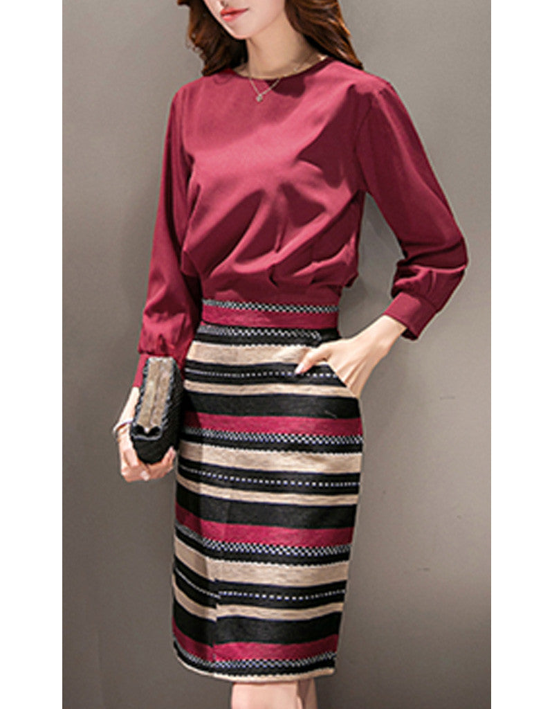 Long sleeve top with mid-length multi-coloured skirt