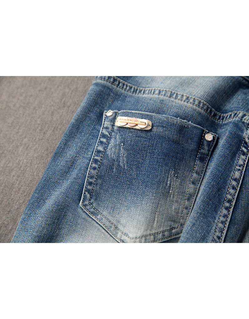 Jeans with sewn-on sequins and butterfly motifs