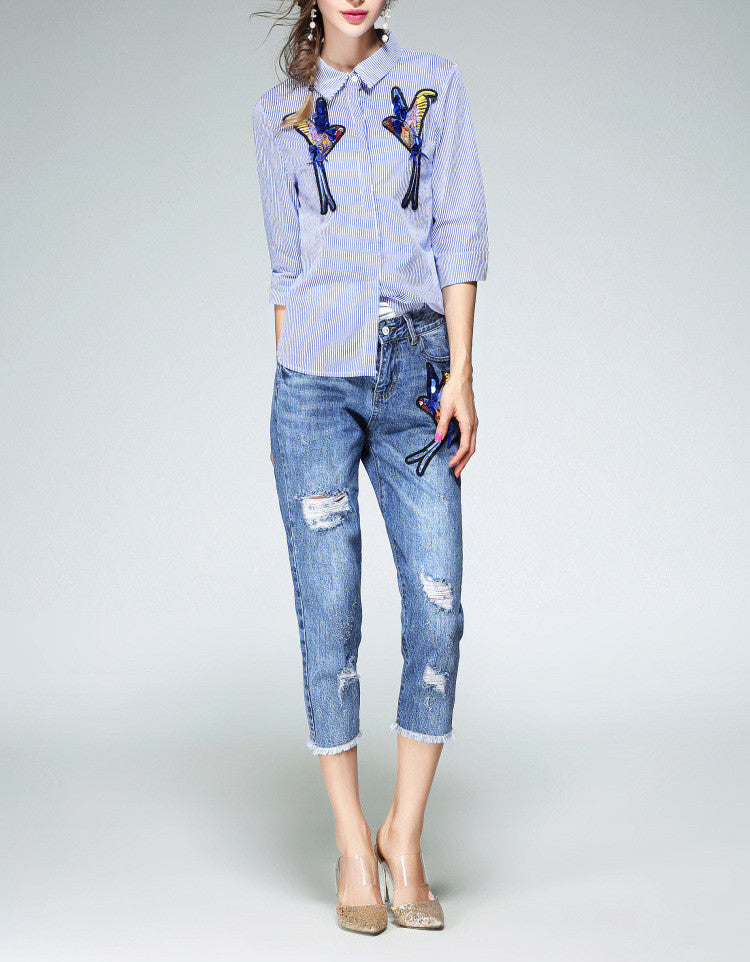 Distressed jeans with birdie design in sequins, beads and embroidery