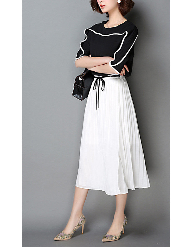 Monochrome mid-length sleeve top with pleated skirt