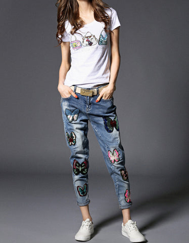 Distressed jeans with birdie design in sequins, beads and embroidery