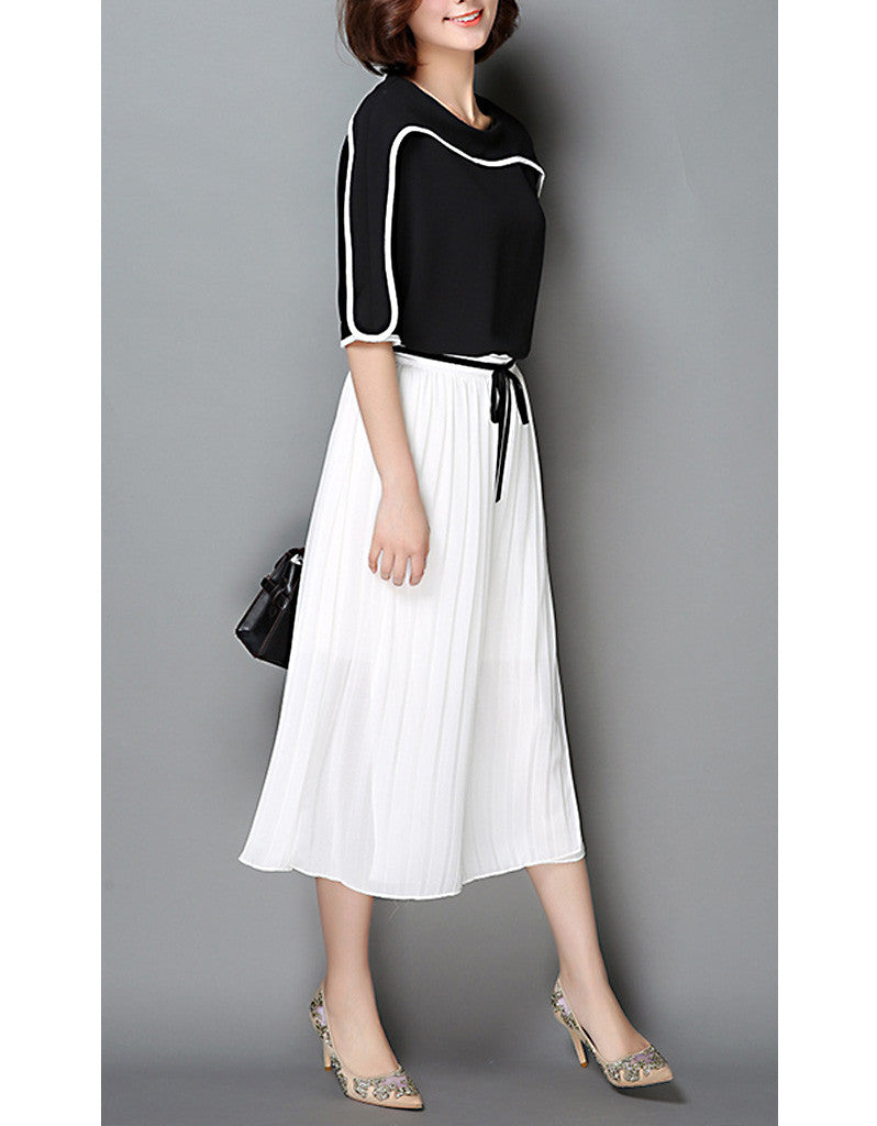 Monochrome mid-length sleeve top with pleated skirt