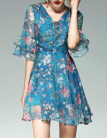 Long sleeve mid-length dress with embroidery and chiffon